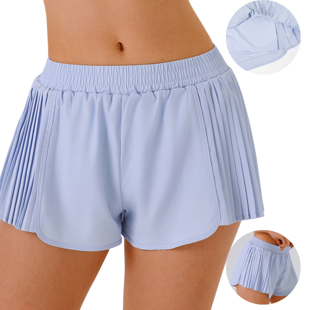 Shorts running con plises laterales