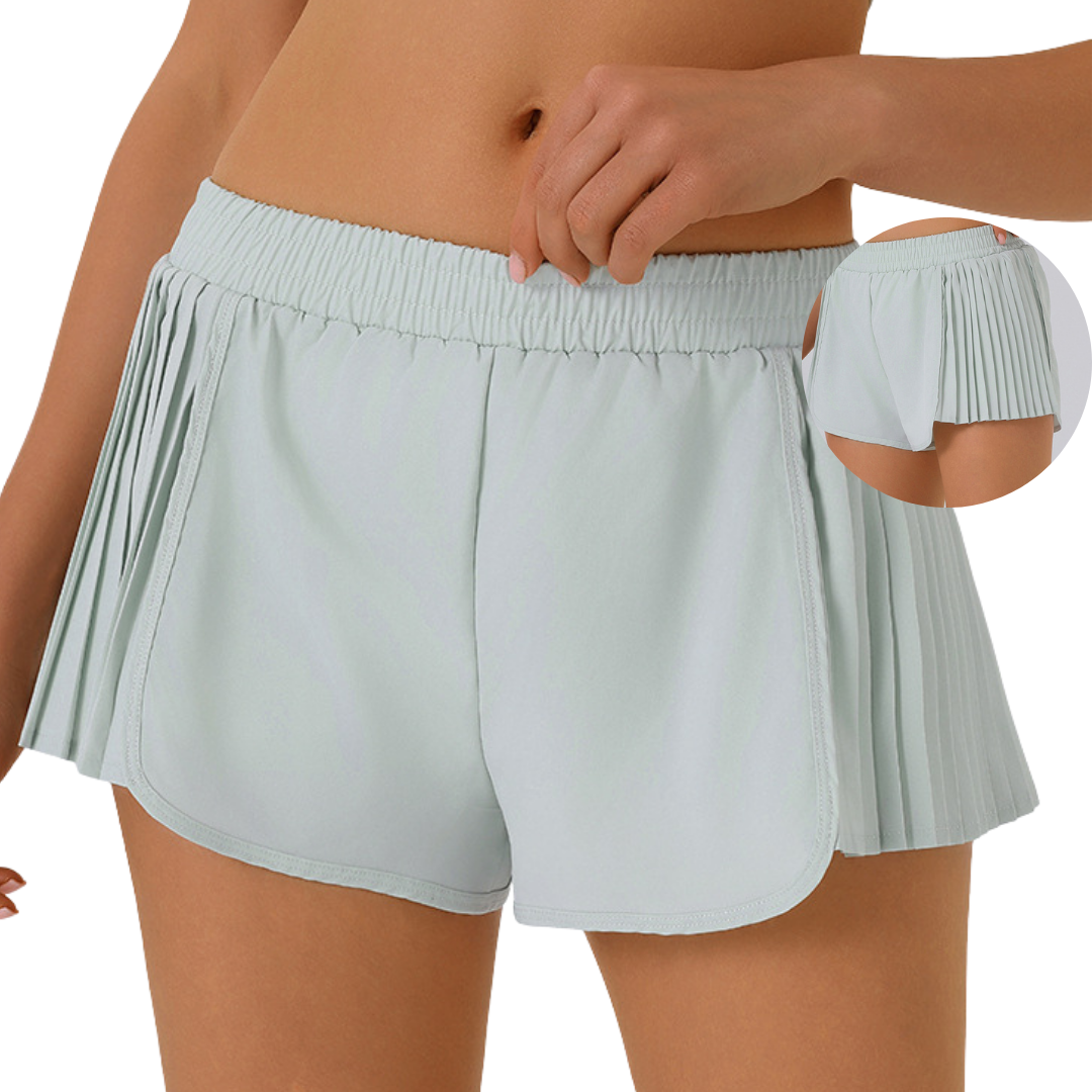 Shorts running con plises laterales