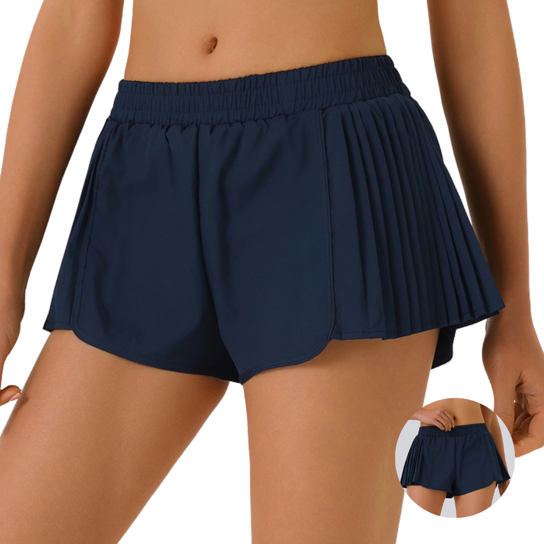 Shorts running con plises laterales