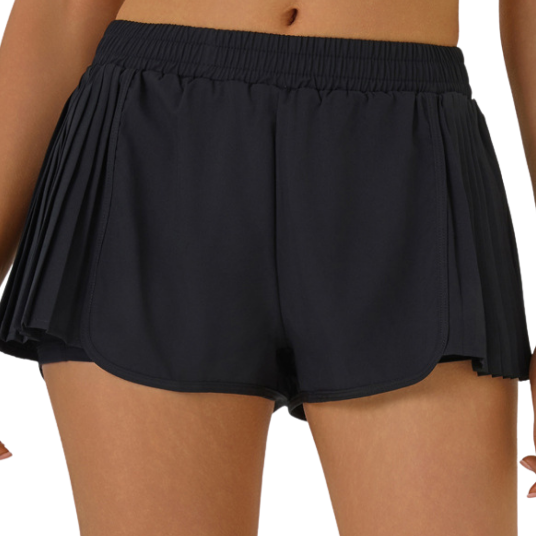 Shorts running con plises laterales